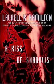 book cover of Besos oscuros by Laurell K. Hamilton