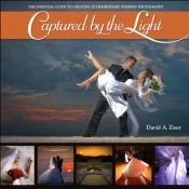book cover of Captured by the Light: The Essential Guide to Creating Extraordinary Wedding Photography by David Ziser
